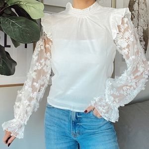 WHITE TURTLENECK W FLORAL MESH SLEEVES